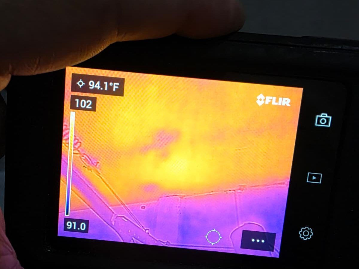 Thermal camera screen showing warmer and cooler areas of a ceiling.